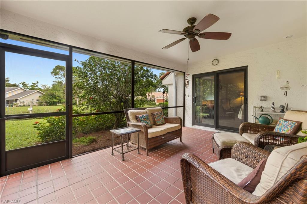 5120 Alpha Court Naples, FL 34105 - Photo 12 of 18 a living room with furniture and a large window