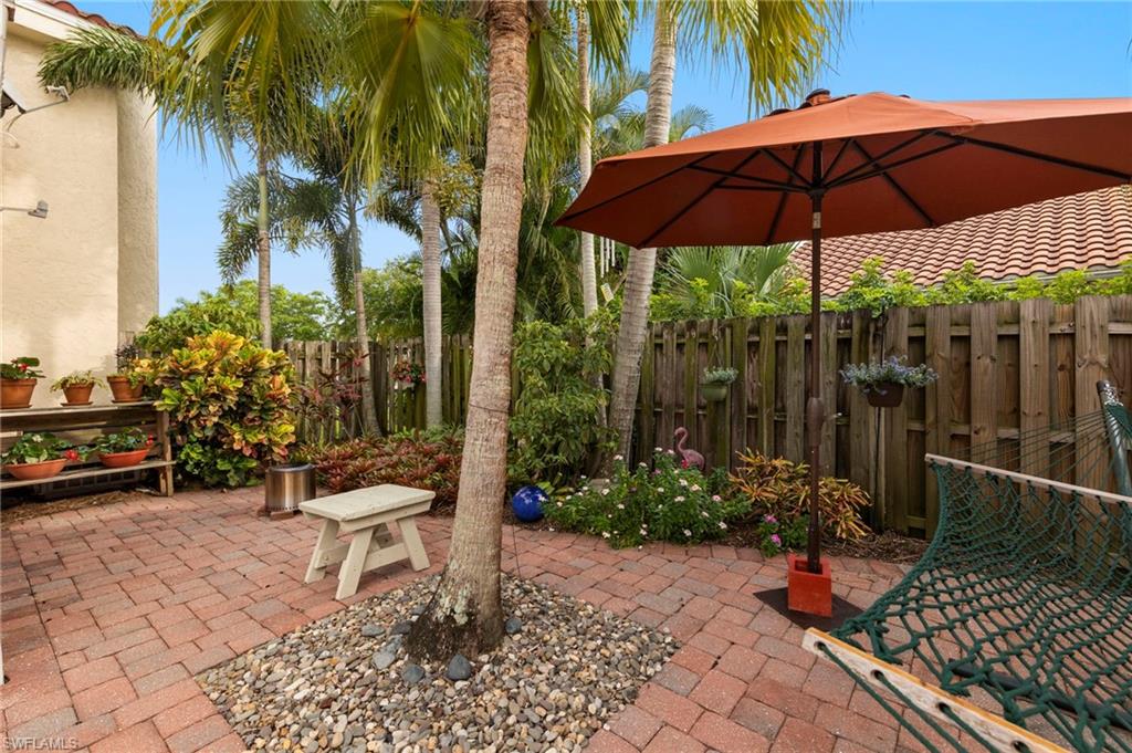 5120 Alpha Court Naples, FL 34105 - Photo 13 of 18 a garden view with a seating space