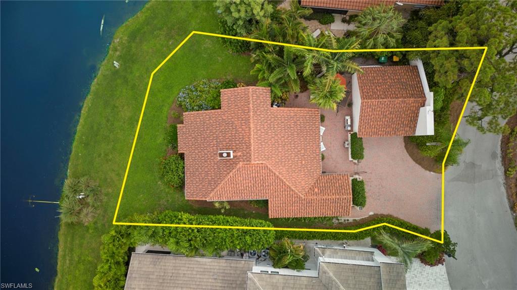 5120 Alpha Court Naples, FL 34105 - Photo 15 of 18 a view of a yard with swimming pool