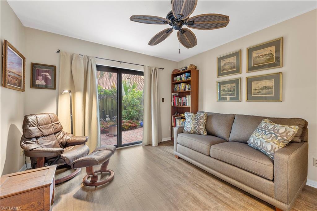 5120 Alpha Court Naples, FL 34105 - Photo 10 of 18 a living room with furniture and a large window