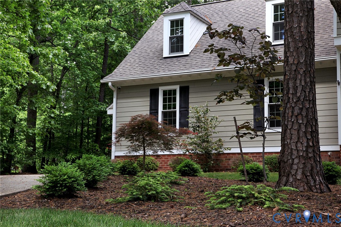231 Hazelmere Drive Chesterfield, VA 23236 - Photo 24 of 33 a front view of a house with garden