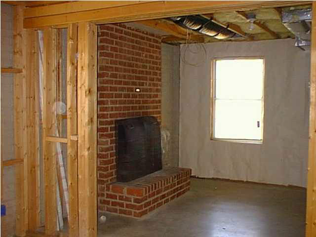 805 Harris Road Charlottesville, VA 22902 - Photo 5 of 9 a view of an empty room with wooden floor and a window