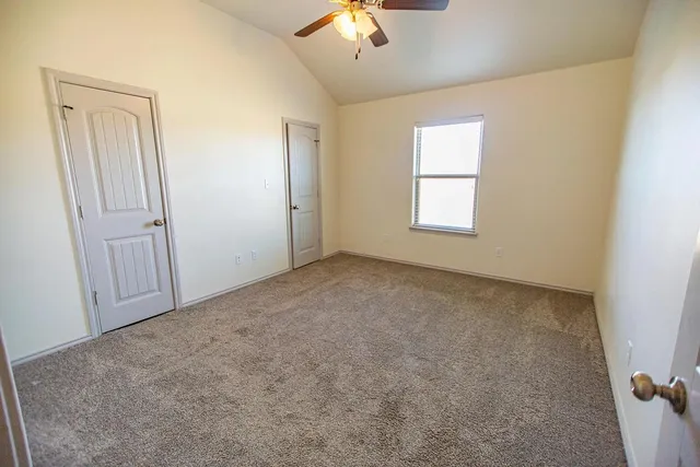 a view of a livingroom with a chandelier fan