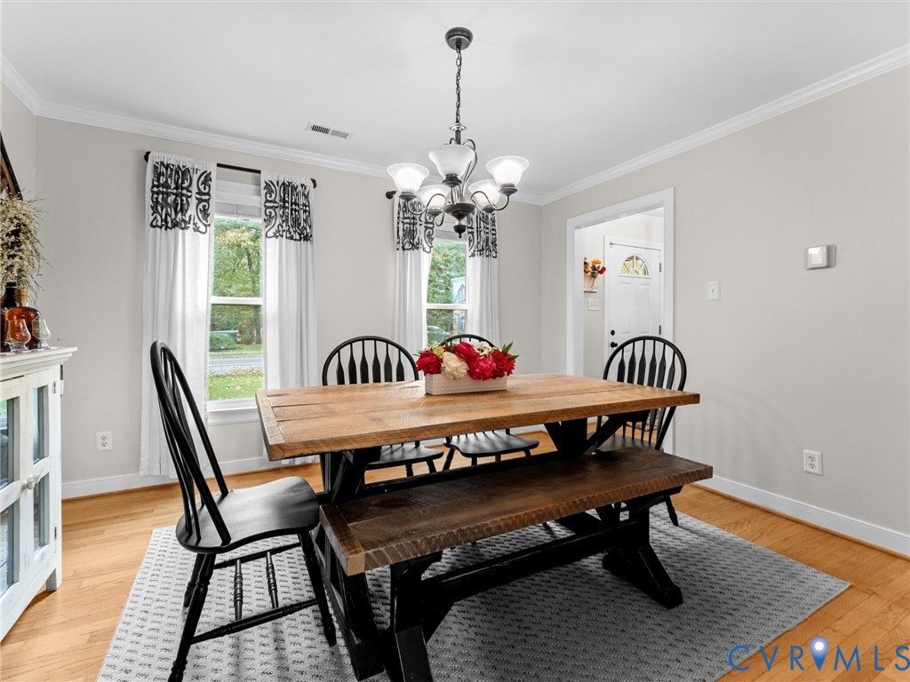 419 Walton Park Road Midlothian, VA 23114 - Photo 11 of 47 a view of a dining room with furniture window and wooden floor