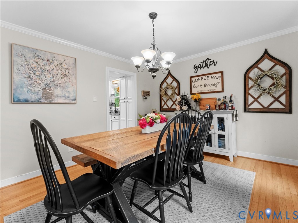 419 Walton Park Road Midlothian, VA 23114 - Photo 12 of 47 a view of a dining room with furniture and wooden floor