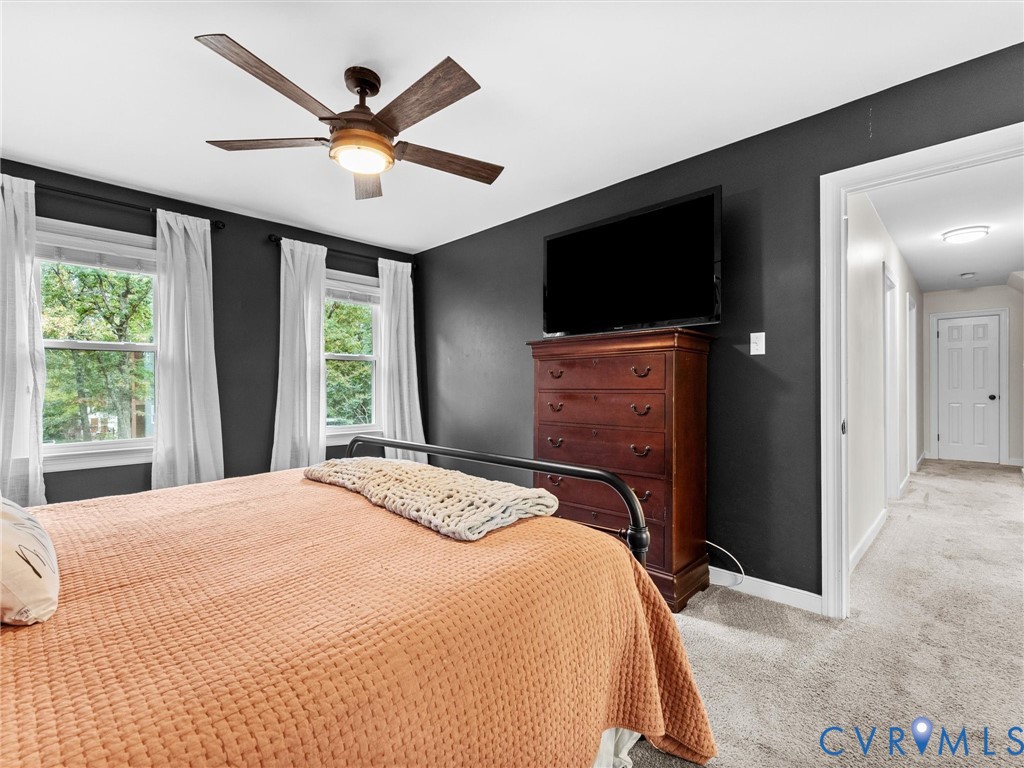 419 Walton Park Road Midlothian, VA 23114 - Photo 19 of 47 a bedroom with a bed and a flat screen tv