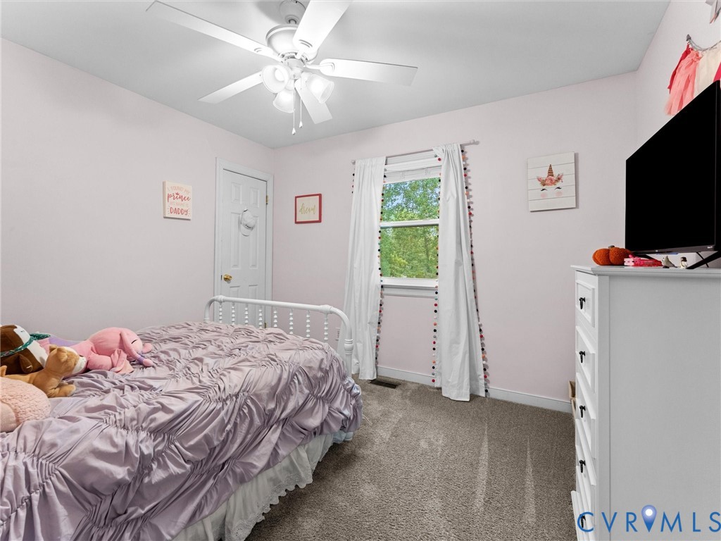 419 Walton Park Road Midlothian, VA 23114 - Photo 21 of 47 a bedroom with a bed and a flat screen tv