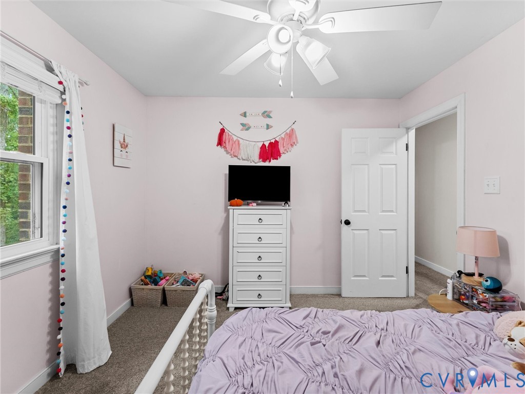 419 Walton Park Road Midlothian, VA 23114 - Photo 22 of 47 a bedroom with a bed and flat screen tv