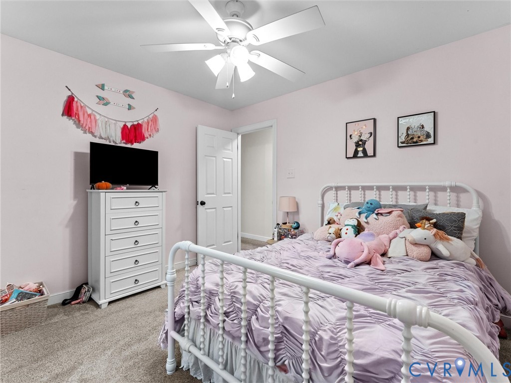419 Walton Park Road Midlothian, VA 23114 - Photo 23 of 47 a bedroom with a bed and a flat screen tv