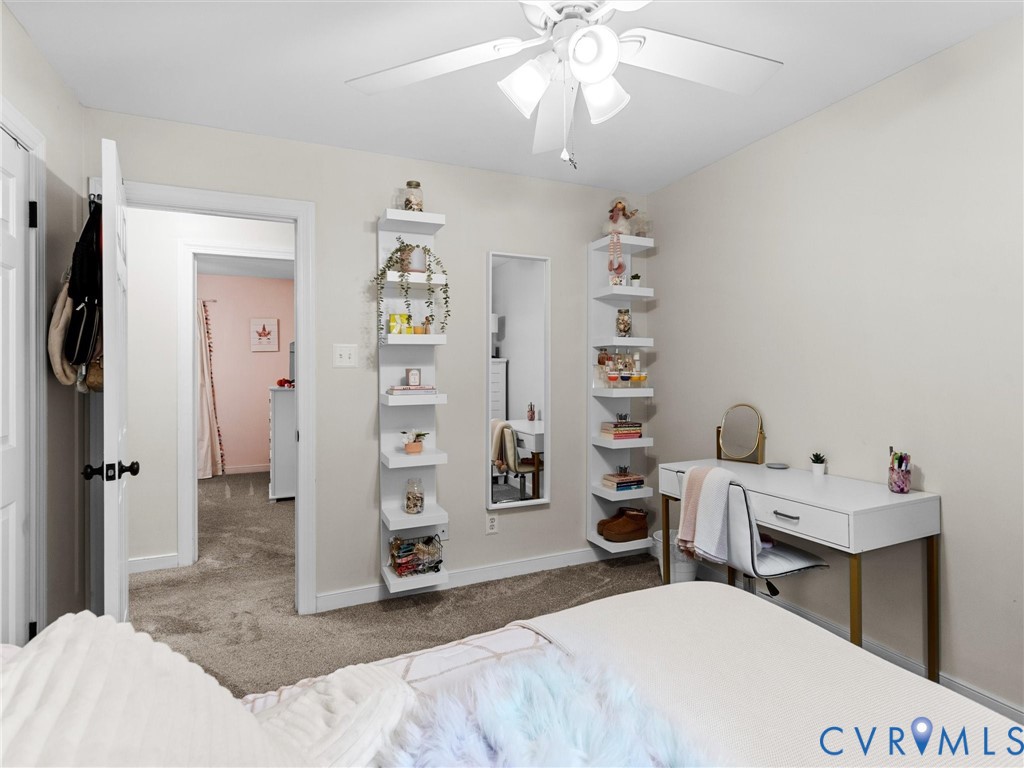 419 Walton Park Road Midlothian, VA 23114 - Photo 24 of 47 a bedroom with a bed and a chandelier