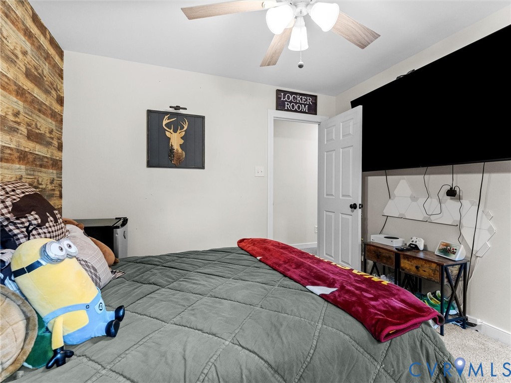 419 Walton Park Road Midlothian, VA 23114 - Photo 27 of 47 a bedroom with a bed and a flat screen tv