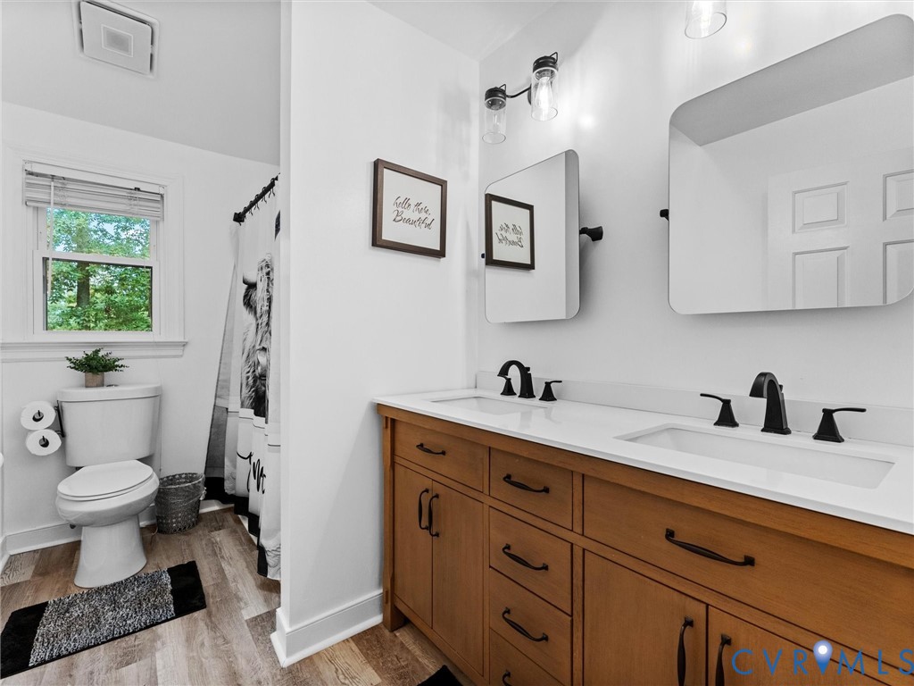 419 Walton Park Road Midlothian, VA 23114 - Photo 33 of 47 a bathroom with a granite countertop sink mirror vanity and toilet