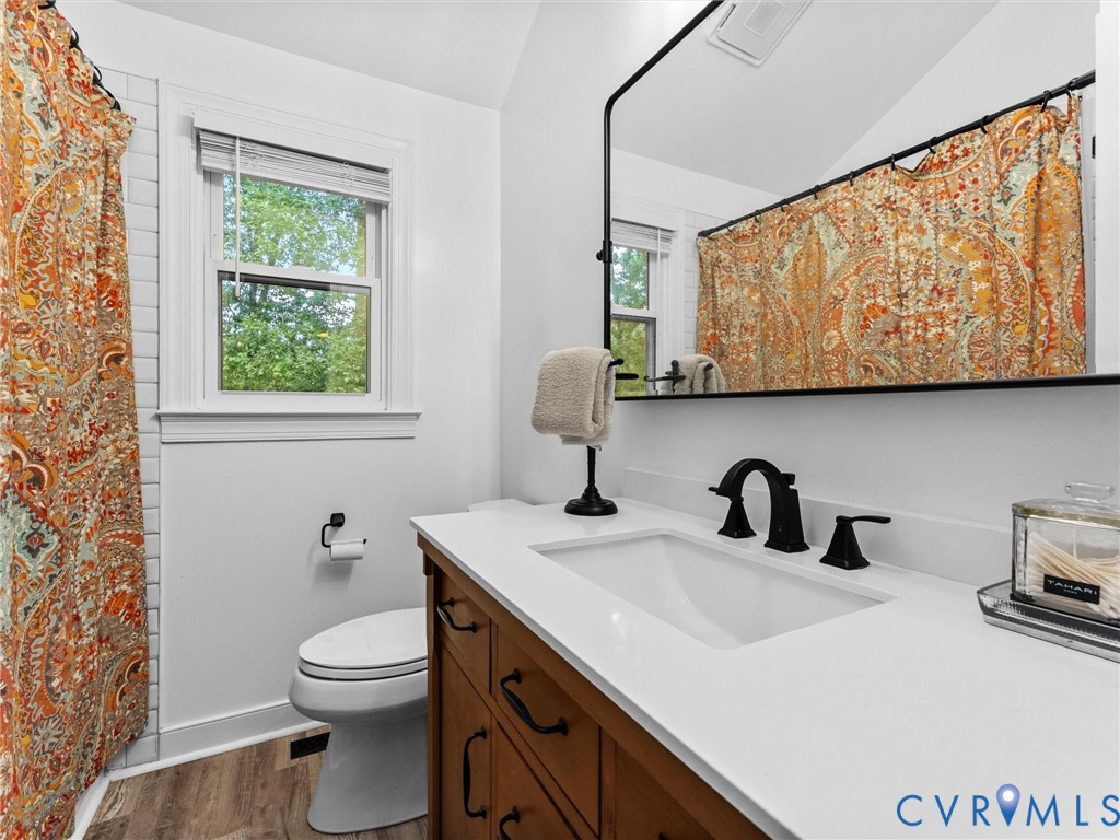 419 Walton Park Road Midlothian, VA 23114 - Photo 34 of 47 a bathroom with a sink a toilet and mirror
