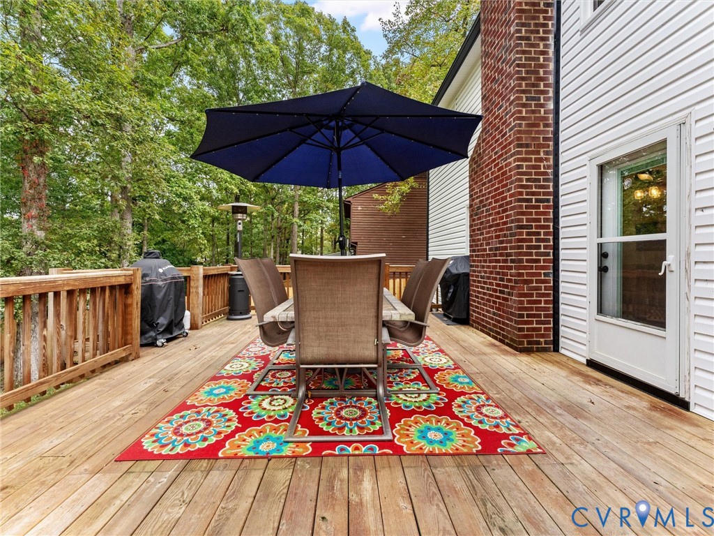 419 Walton Park Road Midlothian, VA 23114 - Photo 38 of 47 a balcony with wooden floor table and chairs