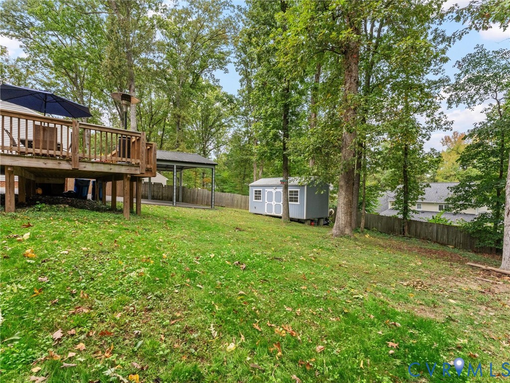 419 Walton Park Road Midlothian, VA 23114 - Photo 41 of 47 a backyard of a house with table and chairs