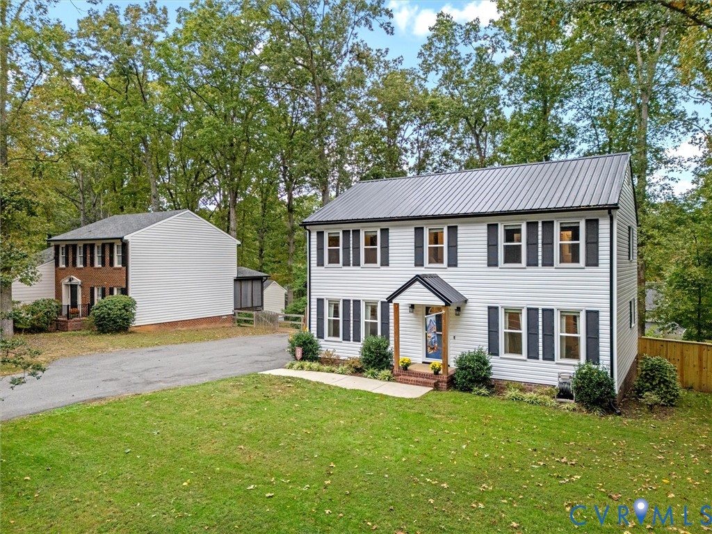 419 Walton Park Road Midlothian, VA 23114 - Photo 47 of 47 a front view of a house with a garden and porch