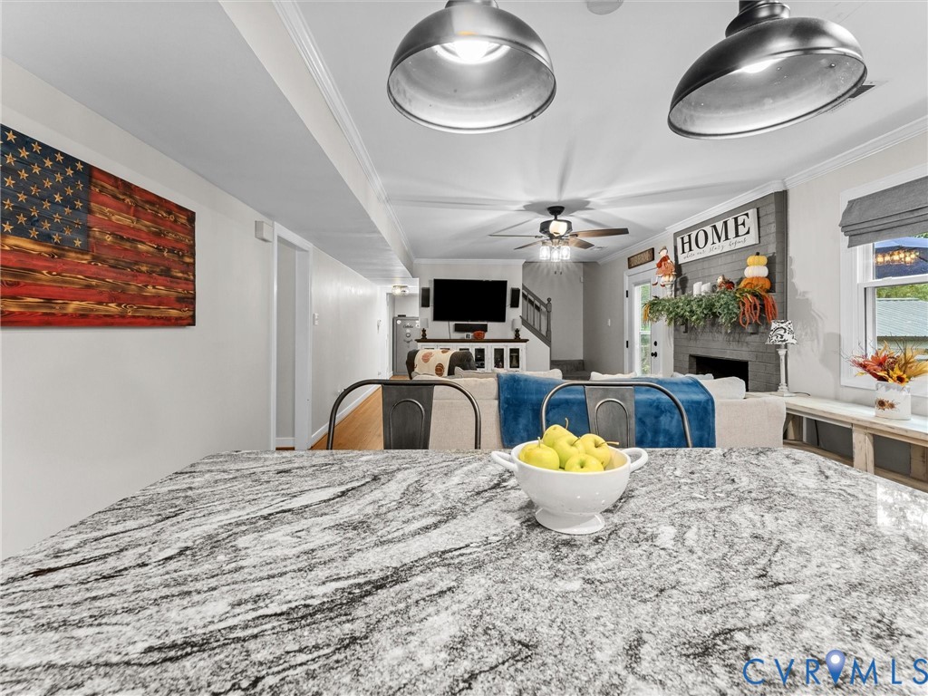 419 Walton Park Road Midlothian, VA 23114 - Photo 6 of 47 a bedroom with a large bed a chandelier and a mirror