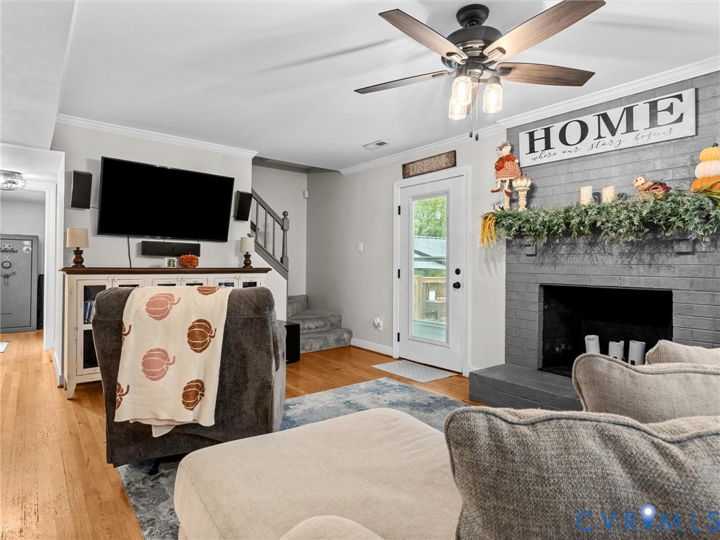 419 Walton Park Road Midlothian, VA 23114 - Photo 7 of 47 a living room with furniture and a flat screen tv