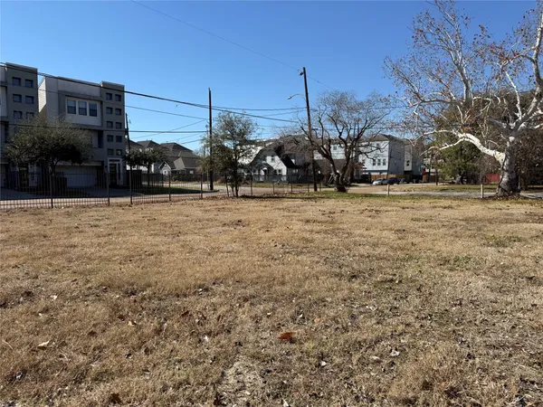 a view of a large house with a yard