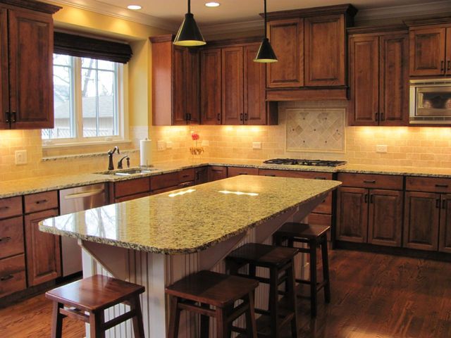 4525 Sterling Road Downers Grove, IL 60515 - Photo 2 of 9 a kitchen with granite countertop a table chairs sink and cabinets
