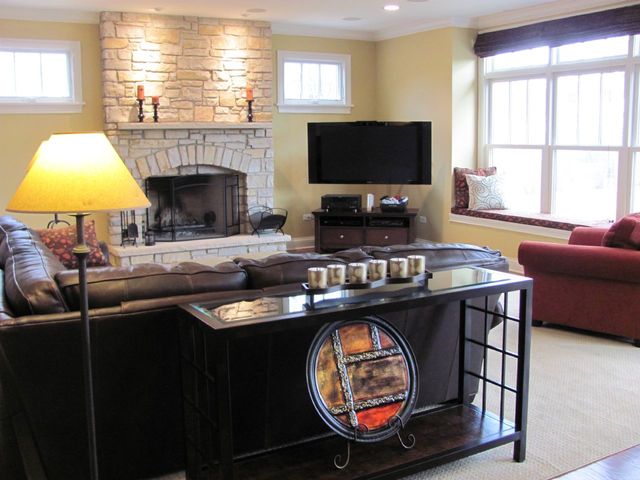 4525 Sterling Road Downers Grove, IL 60515 - Photo 5 of 9 a kitchen with a stove a sink and a flat screen tv
