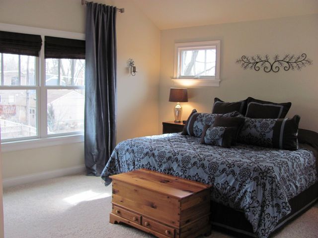 4525 Sterling Road Downers Grove, IL 60515 - Photo 7 of 9 a bedroom with a bed and window