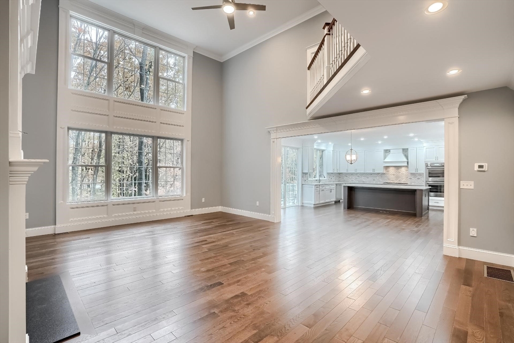 19 Stoney Brook Road Hopkinton, MA 01748 - Photo 12 of 41 a view of an empty room with wooden floor and a window