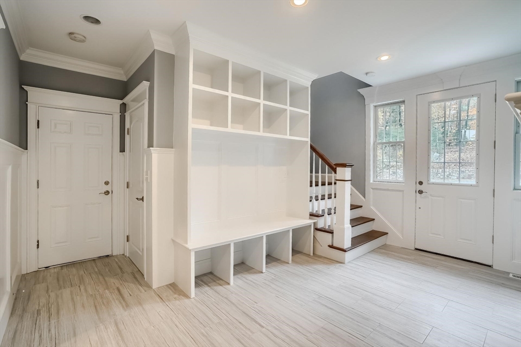 19 Stoney Brook Road Hopkinton, MA 01748 - Photo 19 of 41 an entryway and livingroom with furniture
