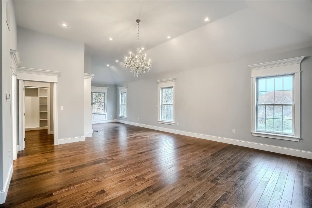 19 Stoney Brook Road Hopkinton, MA 01748 - Photo 21 of 41 an empty room with wooden floor and windows