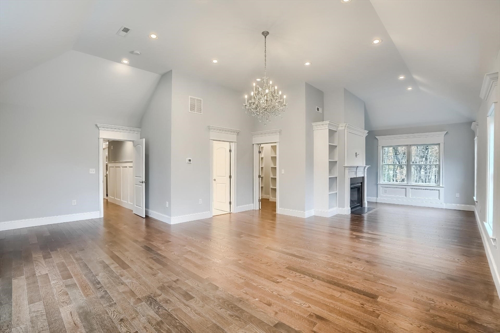 19 Stoney Brook Road Hopkinton, MA 01748 - Photo 22 of 41 an empty room with wooden floor and windows