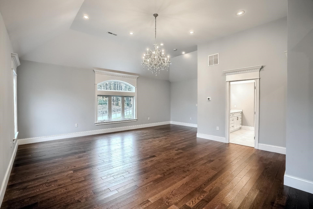 19 Stoney Brook Road Hopkinton, MA 01748 - Photo 23 of 41 a view of an empty room with wooden floor and a window