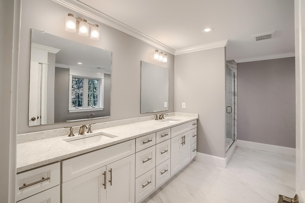 19 Stoney Brook Road Hopkinton, MA 01748 - Photo 25 of 41 a bathroom with double sink and a mirror