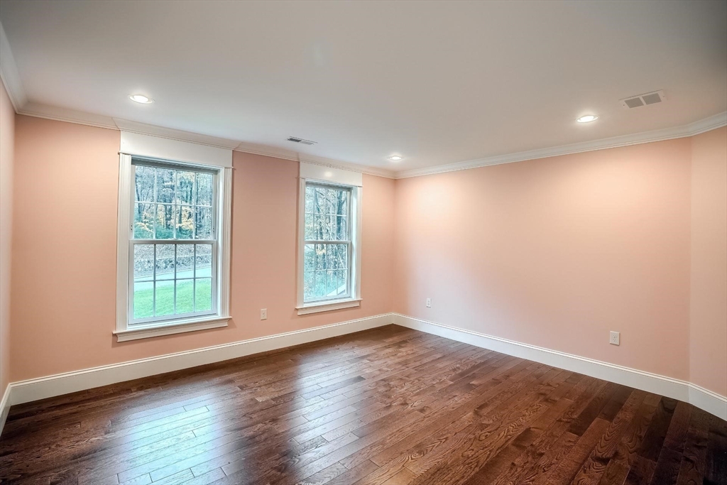 19 Stoney Brook Road Hopkinton, MA 01748 - Photo 27 of 41 an empty room with wooden floor and windows