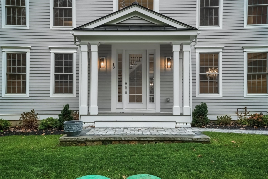 19 Stoney Brook Road Hopkinton, MA 01748 - Photo 3 of 41 a front view of a house with a yard
