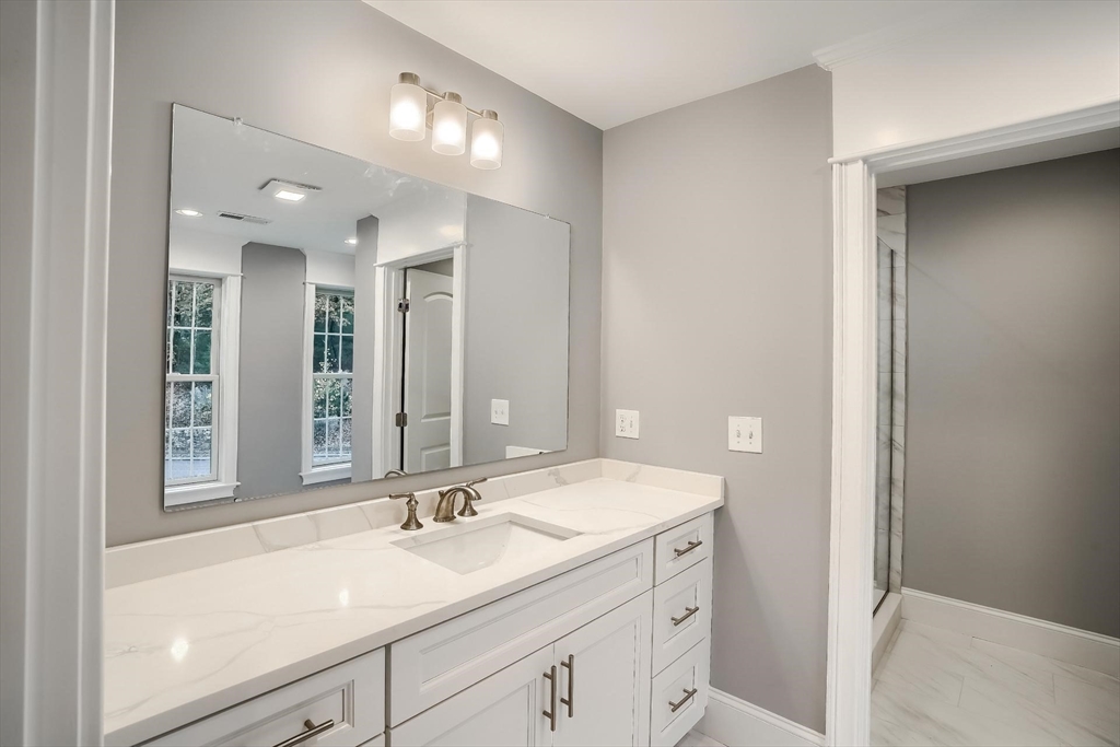 19 Stoney Brook Road Hopkinton, MA 01748 - Photo 34 of 41 a bathroom with a sink and a mirror