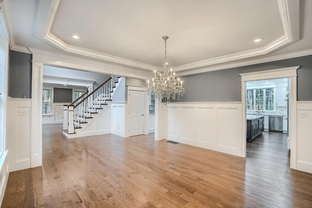 19 Stoney Brook Road Hopkinton, MA 01748 - Photo 6 of 41 a view of a livingroom with wooden floor and stairs