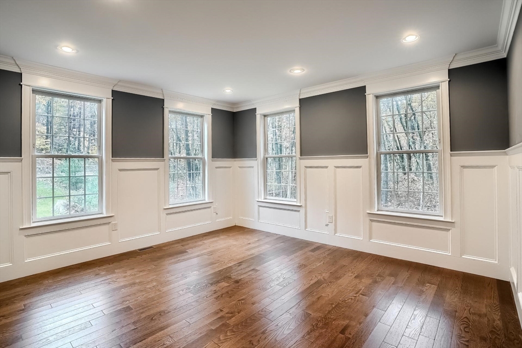 19 Stoney Brook Road Hopkinton, MA 01748 - Photo 8 of 41 a view of an empty room with wooden floor and a window