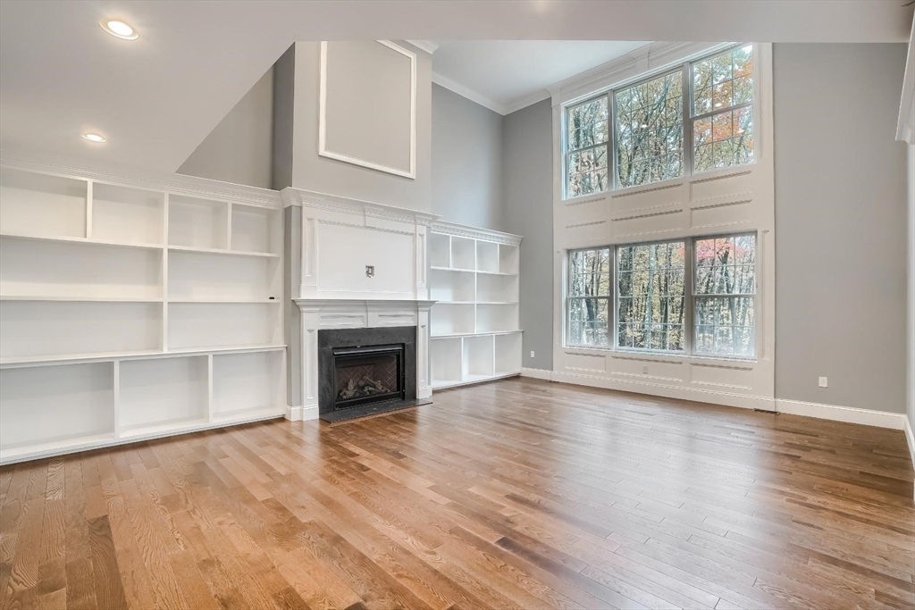 19 Stoney Brook Road Hopkinton, MA 01748 - Photo 10 of 41 a view of an empty room with a window and fireplace