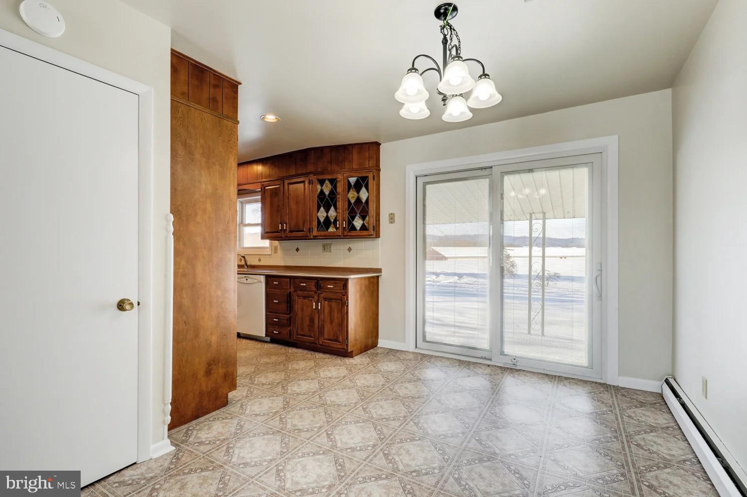 720 South Cocalico Road Denver, PA 17517 - Photo 6 of 14 a view of an empty room with a fireplace and a window
