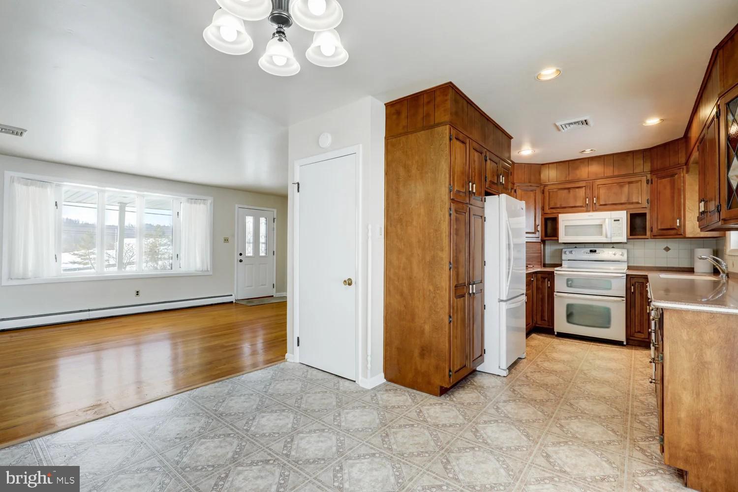 720 South Cocalico Road Denver, PA 17517 - Photo 7 of 14 a view of a kitchen with refrigerator and windows