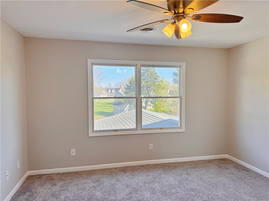 1118 Wedgewood Court Decatur, IL 62526 - Photo 18 of 22 an empty room with a window and a fan
