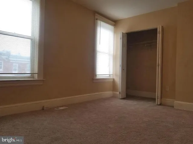 a bathroom with a granite countertop shower and a sink
