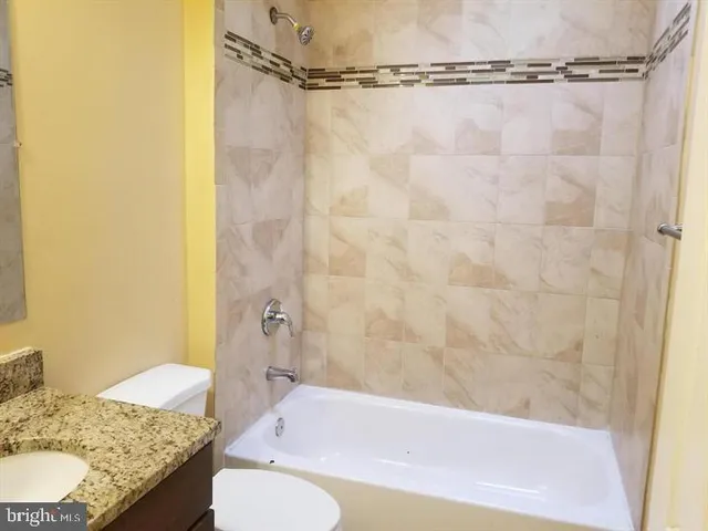 an empty room with closet area