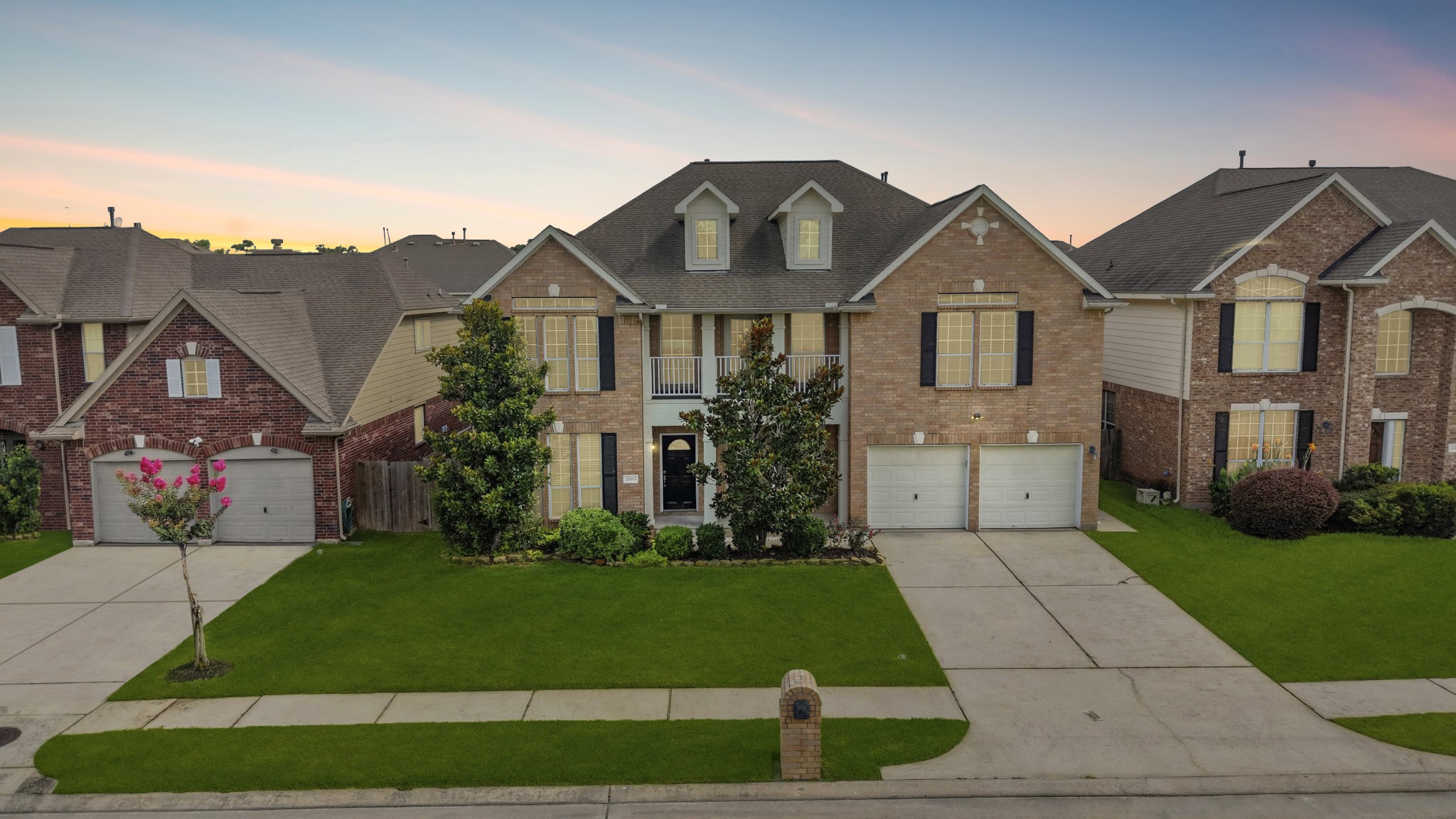 3306 Colleville Sur Mer Lane Spring, TX 77388 - Photo 1 of 30 This stunning two-story brick home offers exceptional curb appeal with its timeless architecture, symmetrical design, and beautifully maintained landscaping. A welcoming covered front porch is framed by elegant columns and accented by upper-level balcony details, creating a grand first impression. The attractive brick facade is complemented by charming dormer windows, decorative shutters, and mature trees that enhance the home's character and charm.