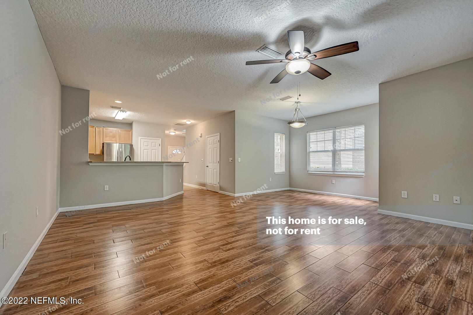 5663 Greenland Road, Unit 1801 Jacksonville, FL 32258 - Photo 14 of 26 a view of an empty room with a window and wooden floor