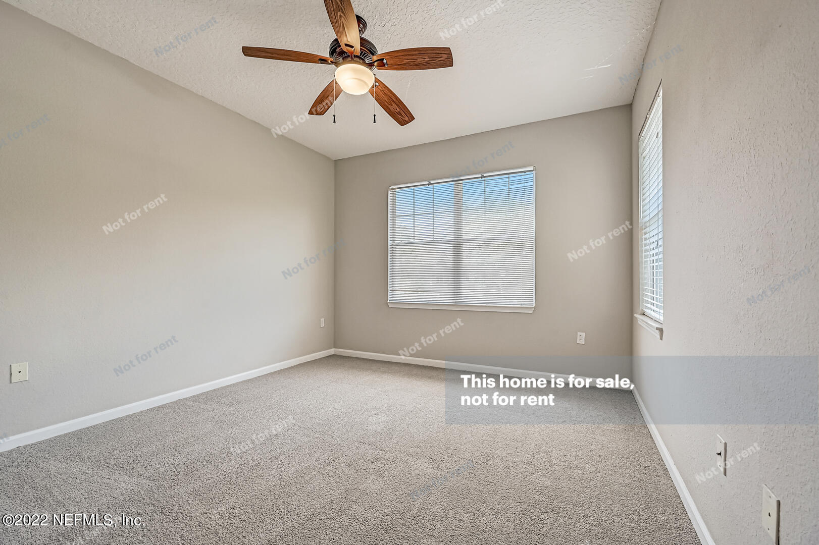 5663 Greenland Road, Unit 1801 Jacksonville, FL 32258 - Photo 21 of 26 an empty room with windows and fan