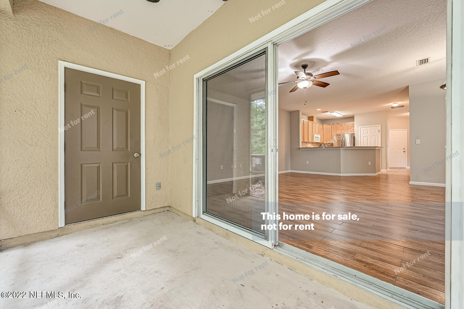 5663 Greenland Road, Unit 1801 Jacksonville, FL 32258 - Photo 25 of 26 an empty room with wooden floor and a bathroom
