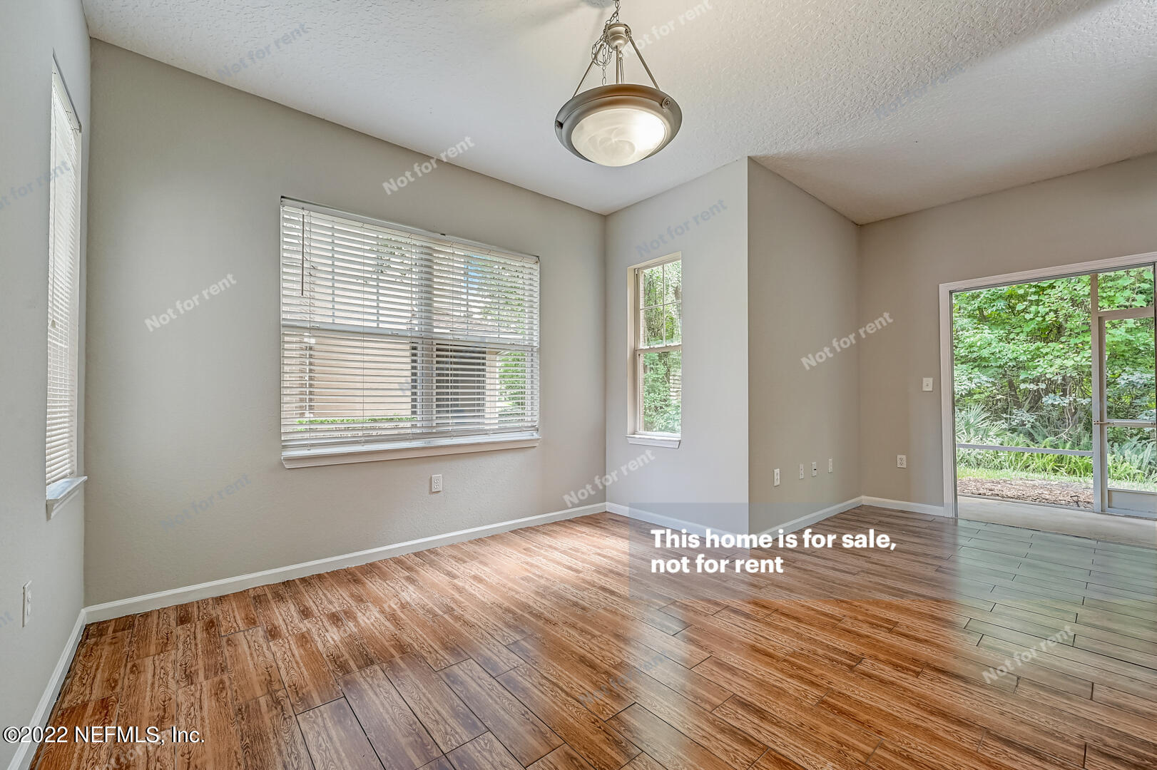 5663 Greenland Road, Unit 1801 Jacksonville, FL 32258 - Photo 5 of 26 a view of empty room with wooden floor and fan