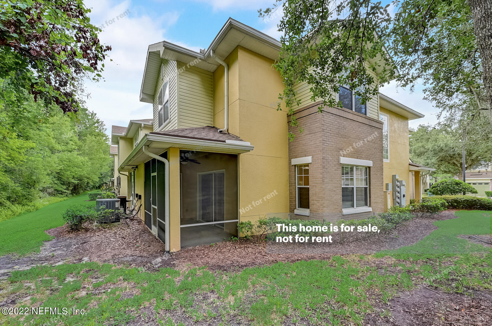 5663 Greenland Road, Unit 1801 Jacksonville, FL 32258 - Photo 9 of 26 a view of a house with many windows and a yard