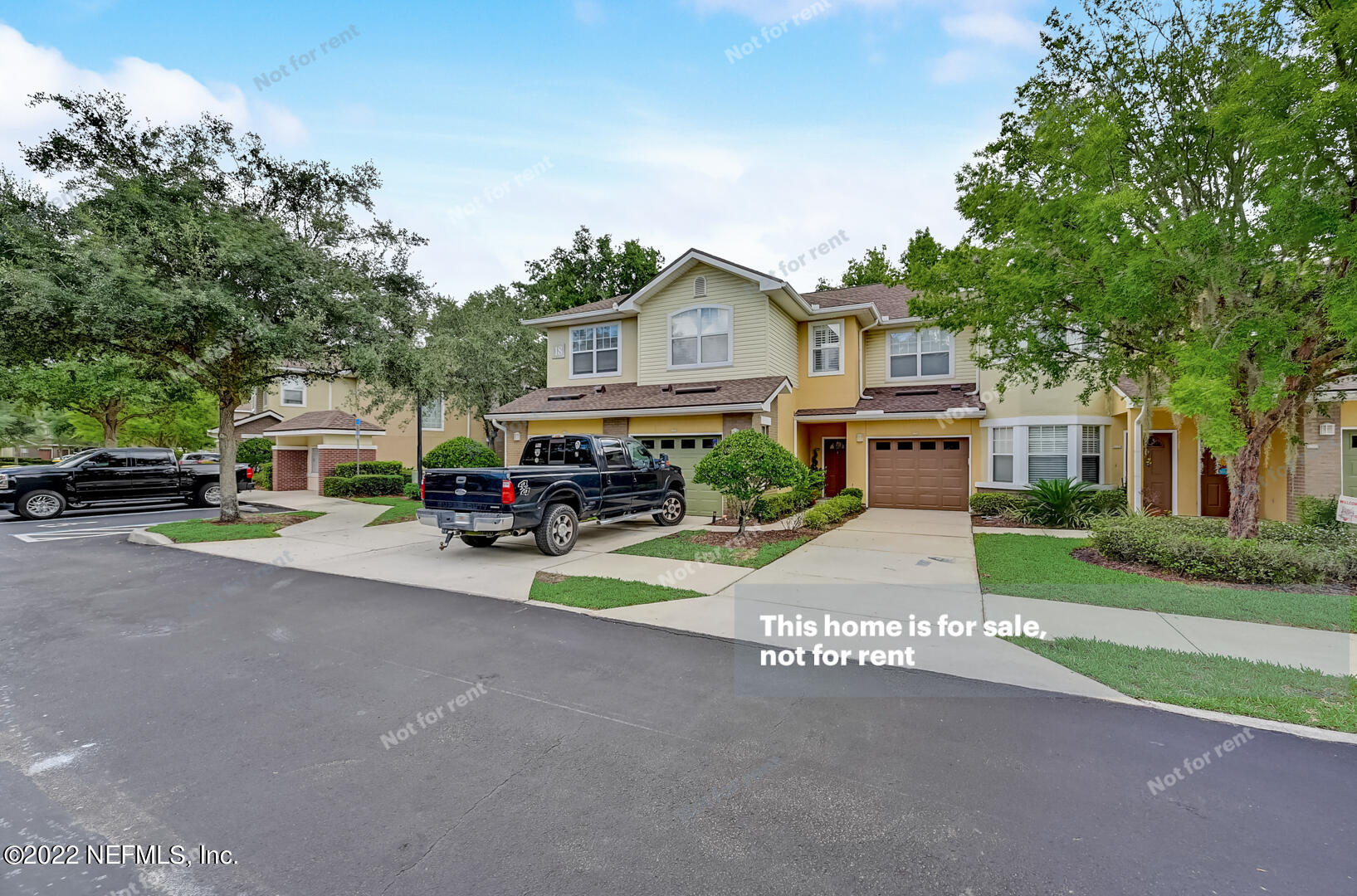 5663 Greenland Road, Unit 1801 Jacksonville, FL 32258 - Photo 10 of 26 a front view of a house with a garden and pathway
